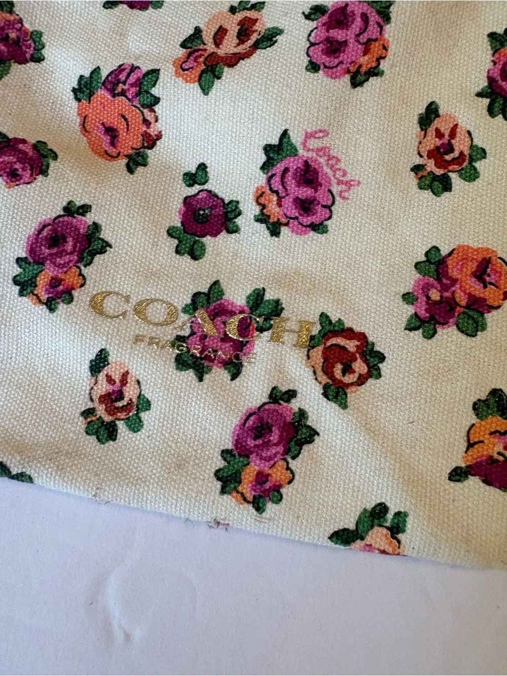 Coach Floral Drawstring Pouch in Cream with Pink & Orange Roses